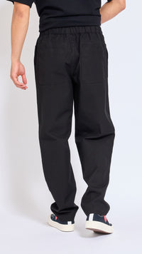 UNDERCOVER BLACK ELASTIC WAIST COTTON PANTS.